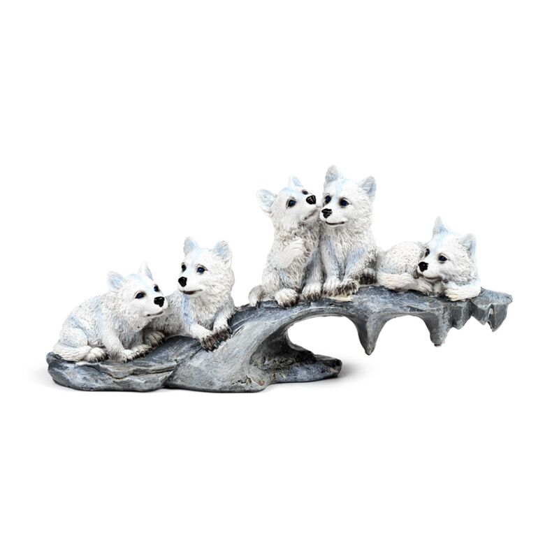 Wolfsfiguren auf Felsen – Winterjunge in Weiß