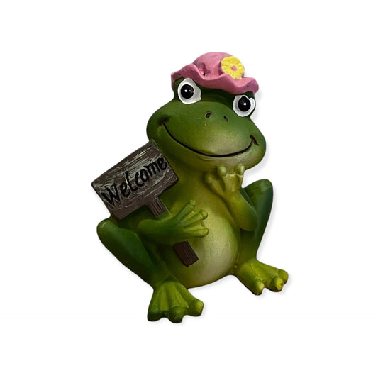 Grappig beeldje van een groene kikker met roze hoed en bord ‘Welcome’ – vrolijke decoratie van polyresin