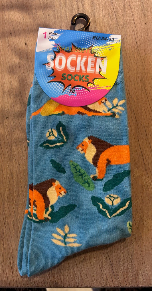 Vrolijke sokken met leeuw en bladeren – blauw oranje design