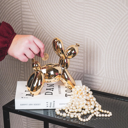Gouden ballon hond spaarpot van Housevitamin – decoratief keramisch beeld