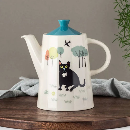 Vintage honden theepot van Hannah Turner – keramiek met zwarte hond en kleurrijke accenten